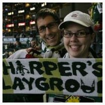 Arbor Lodge Neighborhood couple with banner